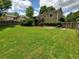 Well-maintained backyard featuring a lush lawn, lovely landscaping, wood deck and privacy fence at 10475 Willow Meadow Cir, Alpharetta, GA 30022