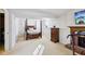 Spacious basement features a brick fireplace, wood bed frame, and a TV at 10475 Willow Meadow Cir, Alpharetta, GA 30022