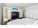 Bright bedroom features a TV, access to a closet, and an ensuite bath at 10475 Willow Meadow Cir, Alpharetta, GA 30022