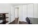 Home office includes a closet, hardwood floors, and views to another room at 10475 Willow Meadow Cir, Alpharetta, GA 30022