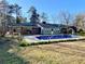 Expansive backyard featuring a sparkling in-ground pool, perfect for outdoor entertaining and relaxation at 6787 Hembree Dr, Austell, GA 30168