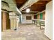 Spacious unfinished basement with workbench area, perfect for storage and hobbies at 6787 Hembree Dr, Austell, GA 30168