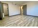 Bright bedroom features wood-look tile flooring and a closet for ample storage at 6787 Hembree Dr, Austell, GA 30168