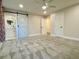 Spacious bedroom showcasing neutral carpet, barn door, and two entrance ways at 6787 Hembree Dr, Austell, GA 30168