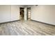 Bedroom features wood-look tile flooring and neutral colors at 6787 Hembree Dr, Austell, GA 30168