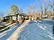Long driveway leading to a carport, offering ample parking space at 6787 Hembree Dr, Austell, GA 30168