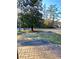 View from the porch showing the front yard and a large tree at 6787 Hembree Dr, Austell, GA 30168