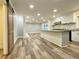 Bright open kitchen featuring a large island, white cabinetry, and modern appliances at 6787 Hembree Dr, Austell, GA 30168
