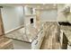 Spacious kitchen with a large granite island, stainless steel appliances, and hardwood floors at 6787 Hembree Dr, Austell, GA 30168