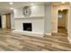Bright living room with white fireplace, modern flooring, and stylish decor at 6787 Hembree Dr, Austell, GA 30168