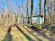 Unique outbuilding tucked away in the trees, offering a serene escape on a secluded lot at 6787 Hembree Dr, Austell, GA 30168