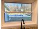 View of a swimming pool from the kitchen window with outdoor greenery at 6787 Hembree Dr, Austell, GA 30168
