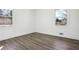 Bright bedroom featuring hardwood floors, fresh white paint, and two large windows with nature views at 1189 Kathryn Cir, Forest Park, GA 30297