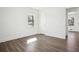 Bright bedroom featuring hardwood floors, fresh white paint, and a large window with natural light at 1189 Kathryn Cir, Forest Park, GA 30297