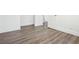Hardwood floors with white trim in a recently painted room with an open door at 1189 Kathryn Cir, Forest Park, GA 30297