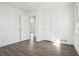 Well-lit bedroom featuring hardwood floors, fresh white paint, and a large window with nature views at 1189 Kathryn Cir, Forest Park, GA 30297