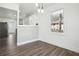 Updated dining room featuring wood floors, white cabinets, a window and kitchen access at 1189 Kathryn Cir, Forest Park, GA 30297