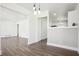 Dining room featuring wood floors, fresh paint, modern lighting, and easy kitchen access at 1189 Kathryn Cir, Forest Park, GA 30297