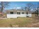 Newly renovated one story home with a white brick exterior and an expansive backyard at 1189 Kathryn Cir, Forest Park, GA 30297