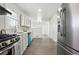 Beautiful updated kitchen with stainless appliances, white cabinets, and hardwood floors at 1189 Kathryn Cir, Forest Park, GA 30297