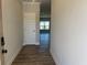 Inviting entryway showcasing the front door and wood-look flooring leading into the home at 4371 Portsbrook Ave, Snellville, GA 30039