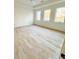 Bright bedroom features large windows and light hardwood flooring at 4524 Mystic Dr, Sandy Springs, GA 30327