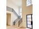 Staircase with natural wood treads, open risers and modern black railing leading to the second floor at 4524 Mystic Dr, Sandy Springs, GA 30327