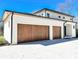 Spacious garage with modern wood doors and ample parking space at 4524 Mystic Dr, Sandy Springs, GA 30327