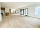Open-concept living room with light hardwood floors and large windows showcasing natural light at 4524 Mystic Dr, Sandy Springs, GA 30327