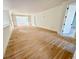 Spacious living room with light hardwood floors and ample natural light at 4524 Mystic Dr, Sandy Springs, GA 30327