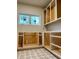 Unfinished pantry space featuring patterned tile floors and built-in shelving at 4524 Mystic Dr, Sandy Springs, GA 30327