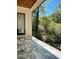Outdoor patio featuring elegant marble flooring and a view of lush greenery at 4524 Mystic Dr, Sandy Springs, GA 30327