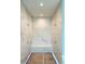 Walk-in shower space featuring elegant marble walls and recessed lighting at 4524 Mystic Dr, Sandy Springs, GA 30327
