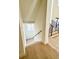 View of the modern staircase with hardwood steps and a black metal railing at 4524 Mystic Dr, Sandy Springs, GA 30327