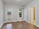 Bedroom with dark wood floors, white trim, and access to the backyard at 1555 Mosaic Way # 1555, Smyrna, GA 30080