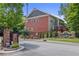 Beautiful exterior of a two-story home in a gated community with landscaped entrance and brick accents at 1555 Mosaic Way # 1555, Smyrna, GA 30080