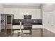 Beautiful kitchen featuring granite countertops, stainless steel appliances, and white cabinetry at 1555 Mosaic Way # 1555, Smyrna, GA 30080
