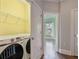 Laundry room with washer, dryer, and shelving at 1555 Mosaic Way # 1555, Smyrna, GA 30080