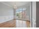 Elegant living room featuring hardwood floors, large windows, and decorative lighting at 1555 Mosaic Way # 1555, Smyrna, GA 30080