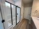 Elegant bathroom featuring a walk-in shower with glass enclosure and modern fixtures at 156 Easton Park Blvd, Dallas, GA 30157