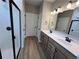 Stylish bathroom showcasing double sinks, a walk-in shower, and contemporary design elements at 156 Easton Park Blvd, Dallas, GA 30157