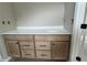 Bathroom vanity with light wood cabinets, white countertop and black hardware at 156 Easton Park Blvd, Dallas, GA 30157