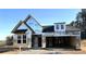 A home under construction with visible framing and weatherproofing, showing potential for customization at 156 Easton Park Blvd, Dallas, GA 30157