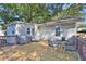 Inviting back deck perfect for outdoor dining with table and chairs, grill, and access to the house at 265 Haas Se Ave, Atlanta, GA 30316