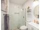 Stylish bathroom features a glass enclosed shower, floating shelves with decor, and sleek vanity at 265 Haas Se Ave, Atlanta, GA 30316