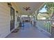 Inviting front porch with a swing, rocking chair, and ceiling fan at 265 Haas Se Ave, Atlanta, GA 30316