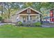 Charming bungalow-style home with a welcoming front porch and a well-manicured lawn at 265 Haas Se Ave, Atlanta, GA 30316