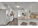 Well-lit kitchen features stainless steel appliances, white cabinets, granite countertops, and a breakfast bar with seating at 265 Haas Se Ave, Atlanta, GA 30316