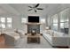 Bright living room with hardwood floors, neutral decor, and a brick fireplace at 265 Haas Se Ave, Atlanta, GA 30316
