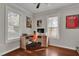 Well-lit home office with hardwood floors, vintage decorations, and bright windows with wooden blinds at 265 Haas Se Ave, Atlanta, GA 30316